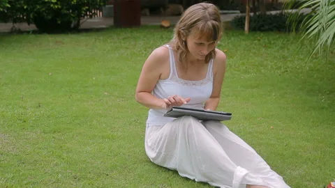 Young mother working on a tablet and play with a baby boy. Stock Footage 101253162