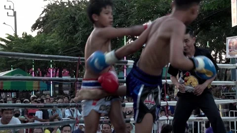 Young Muay Thai boxers are fighting each other, slow motion. Stock Footage 262008301