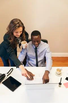 Young Multi-Ethnic Couple Working. Stock Photos