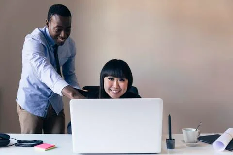 Young Multi-Ethnic Couple Working. Stock Photos