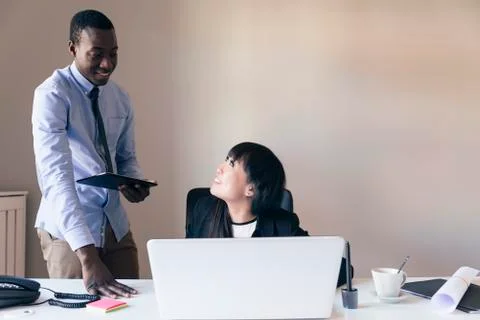 Young Multi-Ethnic Couple Working. Stock Photos