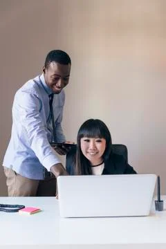 Young Multi-Ethnic Couple Working. Stock Photos