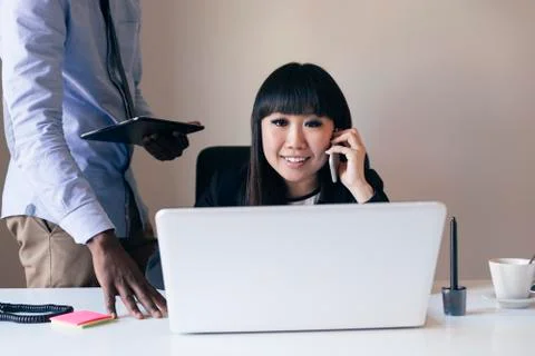 Young Multi-Ethnic Couple Working. Stock Photos