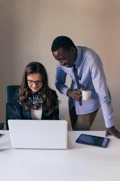 Young Multi-Ethnic Couple Working. Stock Photos
