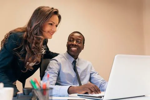 Young Multi-Ethnic Couple Working. Stock Photos