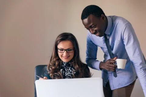 Young Multi-Ethnic Couple Working. Stock Photos