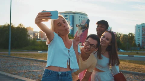 Young multi-ethnic hipster friends on summer holidays make selfie using Stock Footage 201228624