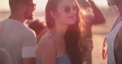 Young multi-ethnic hipsters dancing at summer beach music festival Stock Footage