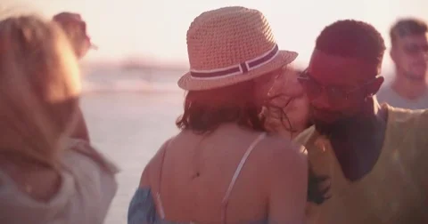 Young multi-ethnic hipsters on summer holidays dancing at beach party Stock Footage 82190959