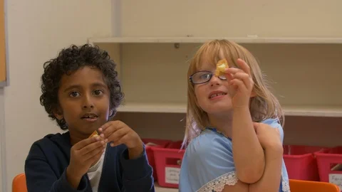 Young Multi Ethnic Kids At School Having Fun With Crackers And Cheese Video stock 111348024