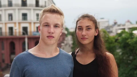 Young multi-ethnic people looking at camera on city street in summer day Stock Footage 94429676