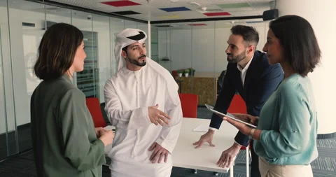 Young multicultural teammates engaged in briefing in meeting room Stock Footage 315555044