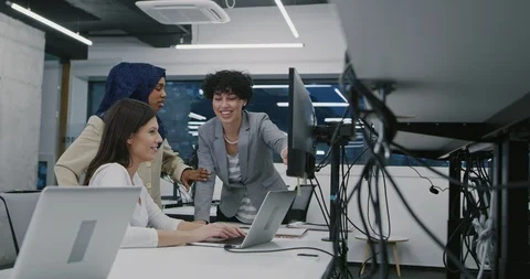 Young multiethnic business team of software developers working together using Stock Footage 114081047