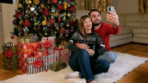 Young multiethnic couple making videocall xmas Stock Footage 165538943