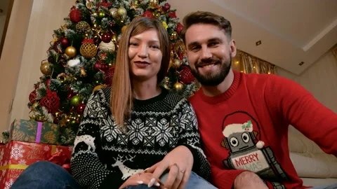 Young multiethnic couple making videocall xmas Stock Footage 166026404