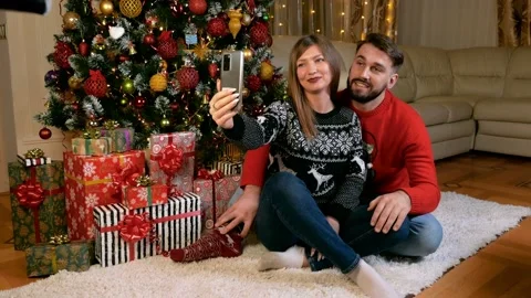 Young multiethnic couple making videocall xmas Stock Footage 166026468