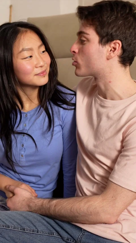 Young multiethnic couple sharing intimate moments at home Stock Footage 305237124