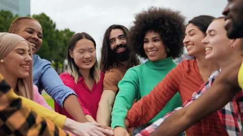 Young multiethnic group of people stacking hands together outdoor - Teamwork 스톡 동영상 194995187