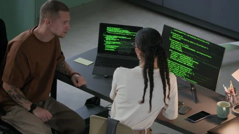 Young Multiethnic IT Colleagues Working on Program Coding in Night Office Stock Footage 292631844