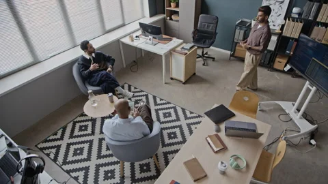 Young Multiethnic Male IT Team Having Informal Meeting in Creative Office Stock Footage 337482764