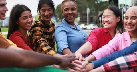 Young multiethnic people having fun stacking hands outdoor Stock Footage 192386084