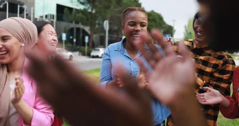 Young multiethnic people having fun clapping hands outdoor Stock Footage 192386111