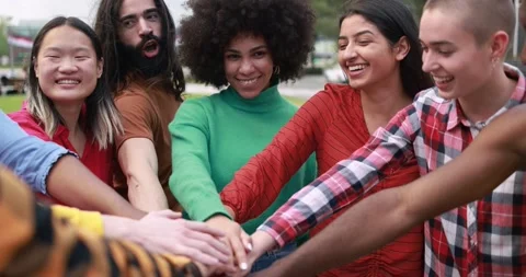 Young multiethnic people having fun stacking hands outdoor Stock Footage 192386467