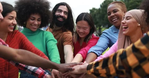 Young multiethnic people having fun stacking hands outdoor Stock Footage 192386552