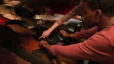 Young Multiethnic Tanners Testing Leather Material in Workshop Stock Footage 299918090