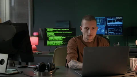 Young Multiethnic Team of IT Specialists Working in Office at Night Stock Footage 292620418