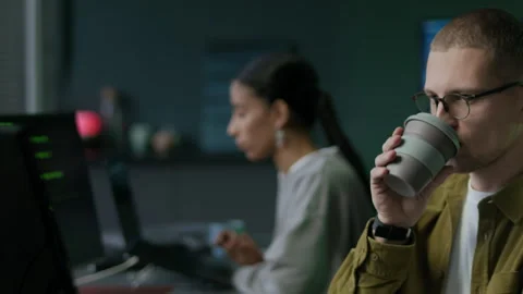 Young Multiethnic Team of Programmers Working in Office at Nighttime Stock Footage 292618296