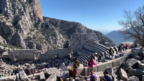 Young multinational tourists walking around at ancient amphitheater Stock Footage 148101413