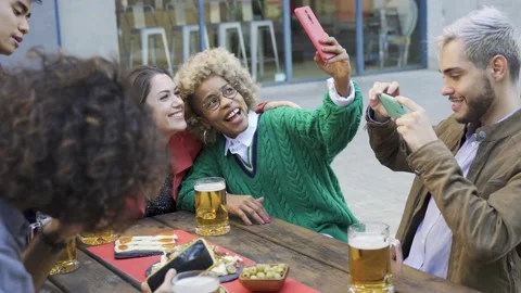 Young multiracial friends having fun doing selfie at brewery bar pub Stock Footage 168251098