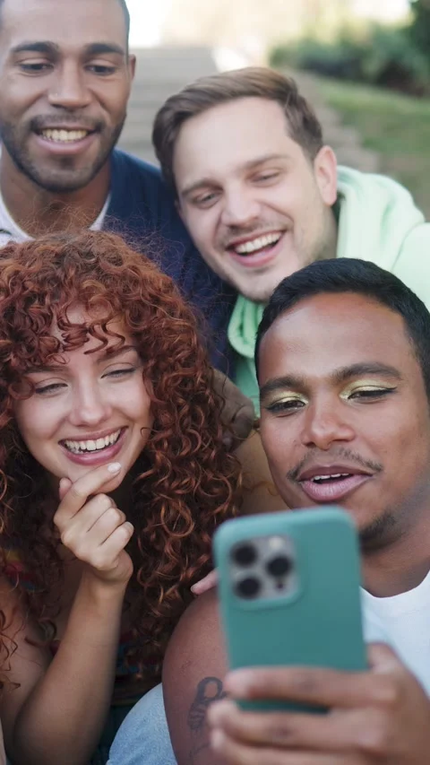 Young multiracial group of friends using mobile smartphone outside of college - Stock Footage 335264103