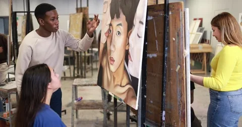 Young multiracial students doing painting art work together at university Stock Footage 168623640