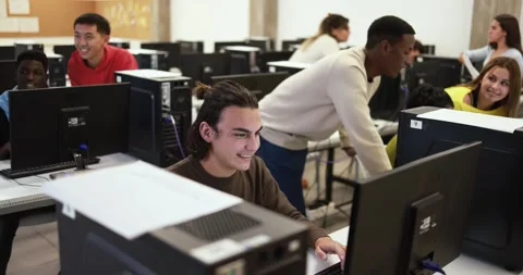 Young multiracial students using computer inside classroom at school Stock Footage 168622769