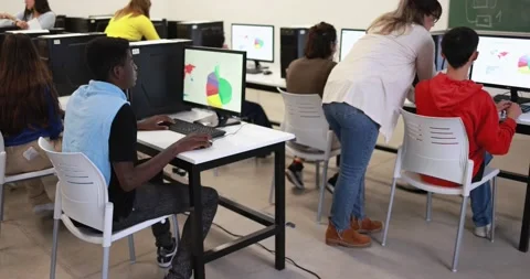 Young multiracial students using computer at school Stock Footage 168623197