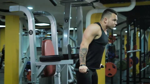 Young muscular man doing exercise at the gym Stock Footage 68417141