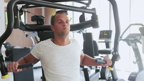 Young Muscular Man Doing Exercise On Chest Press Machine gym. Stock Footage 82107734