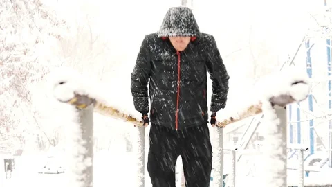 Young muscular man has the training and doing exercise outdoors in winter time. Stock Footage 85366345