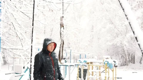 Young muscular man has the training and doing exercise outdoors in winter time. Stock Footage 85366361