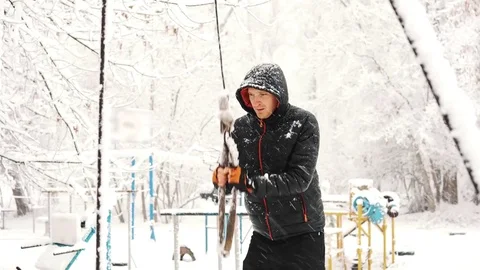 Young muscular man has the training and doing exercise outdoors in winter time. Stock Footage 85366371