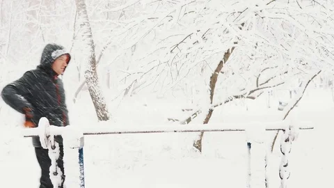 Young muscular man has the training and doing exercise outdoors in winter time. Stock Footage 85366398