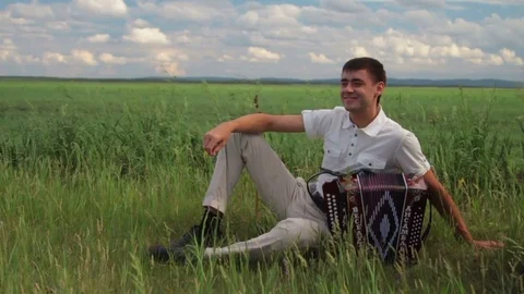 The young musician. The romantic man enjoys by nature. The poet Stock Footage 73482853