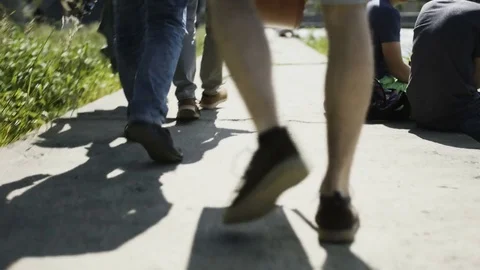 Young Musicians Walking. Only their Legs are Visible Stock Footage
