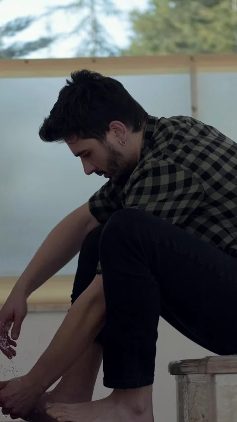Young Muslim man taking ablution for prayer the mosque Stock Footage 296051244