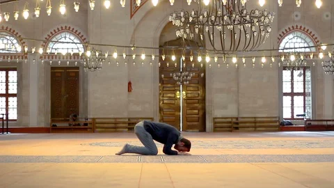 Young muslim praying in mosque Stock Footage 99400716