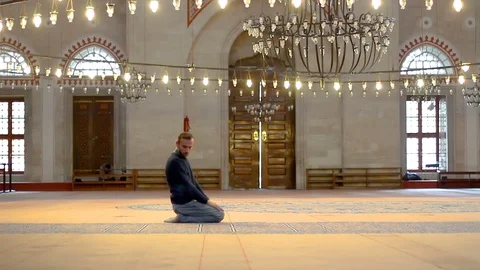 Young muslim praying in mosque Stock Footage 99402823