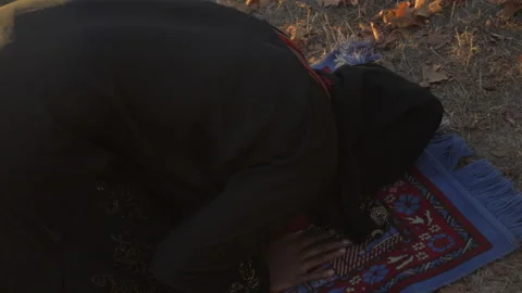 Young Muslim Praying on Prayer Mat Stock Footage 208733892