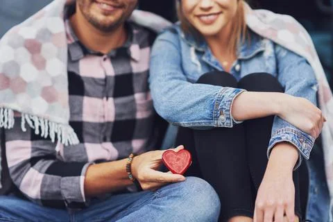 Young nice couple having fun on camping with heart shape Stock Photos